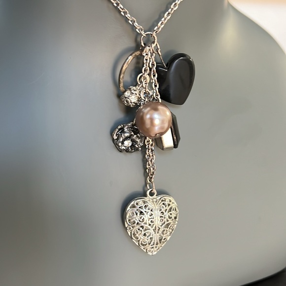 Long silver toned necklace with 8 charms in black and silver heart bead ring - Picture 4 of 9